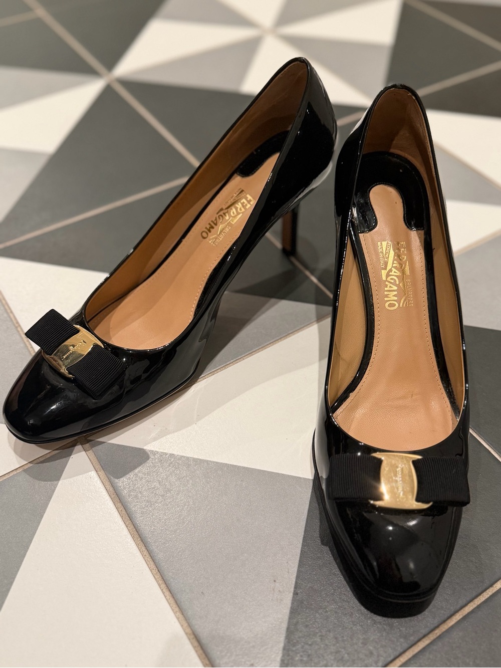 Salvatore Ferragamo Black Patent Vara Bow Pumps with Gold Plate